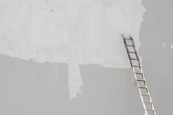 Exterior painting in Provo: ladder against a freshly primed wall
